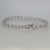 Sterling Silver Semi Mount Tennis Bracelet Setting with stainless steel tongue, designed for customizable gemstone options.